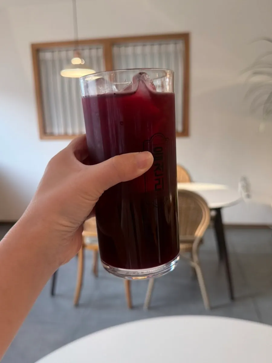 Apple, beet, and carrot juice served with the meal