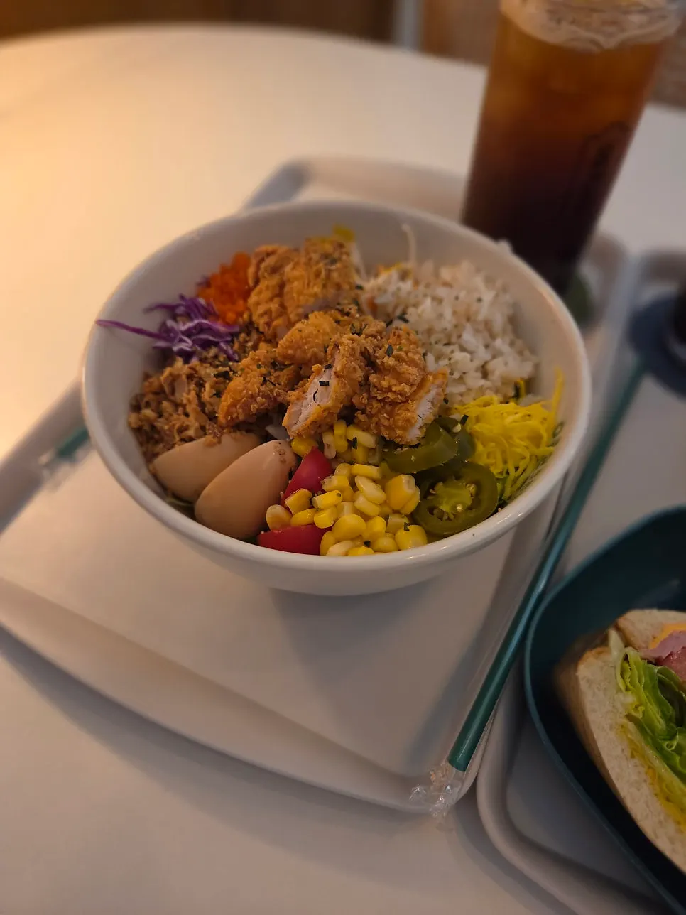 Chicken poke with corn, tomato, and egg toppings