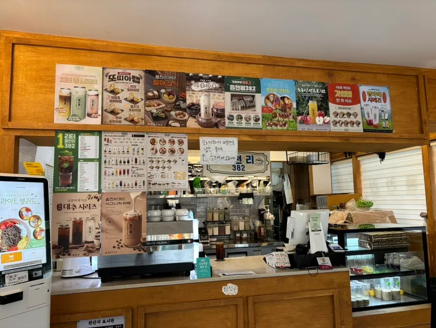 Menu board with photos displayed near the counter
