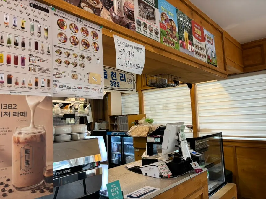 Menu listing poke, sandwiches, and drinks