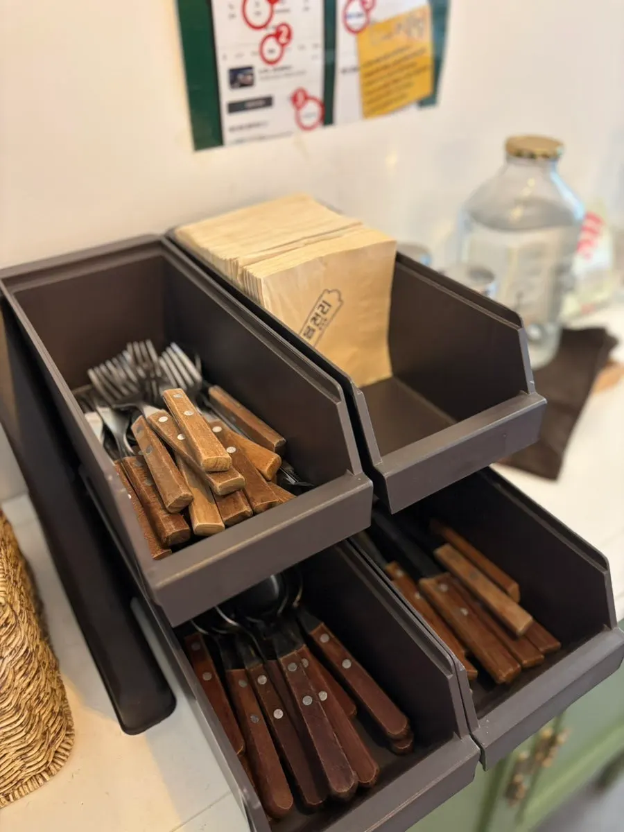 Forks, knives and spoons at the self-serve bar corner