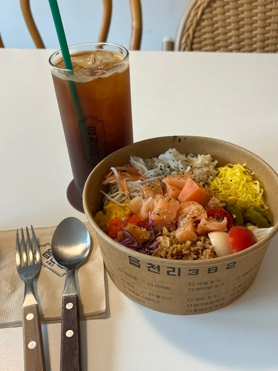 Close-up of poke showing crab stick, grilled egg and sweet pumpkin