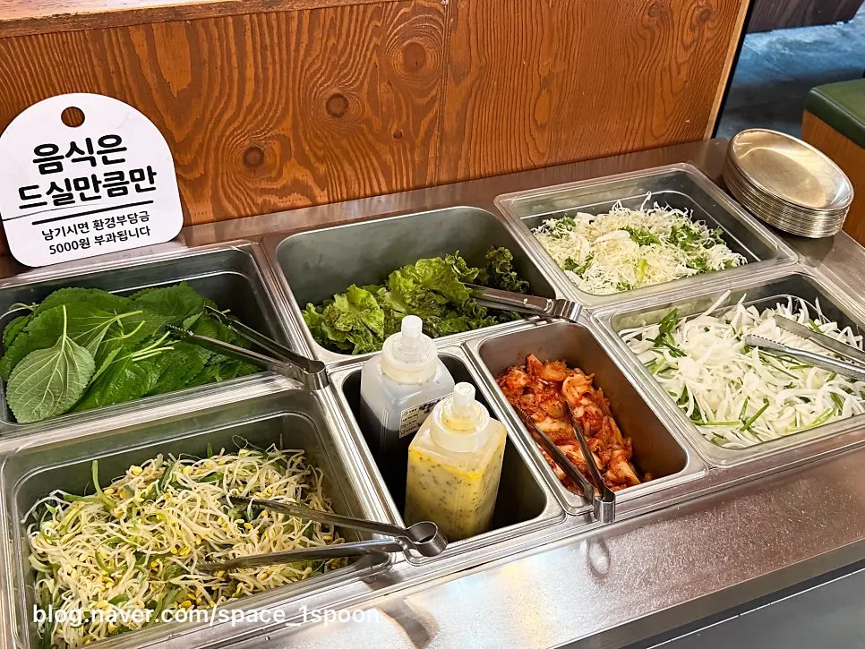 Meat showcase displaying hanwoo and pork cuts