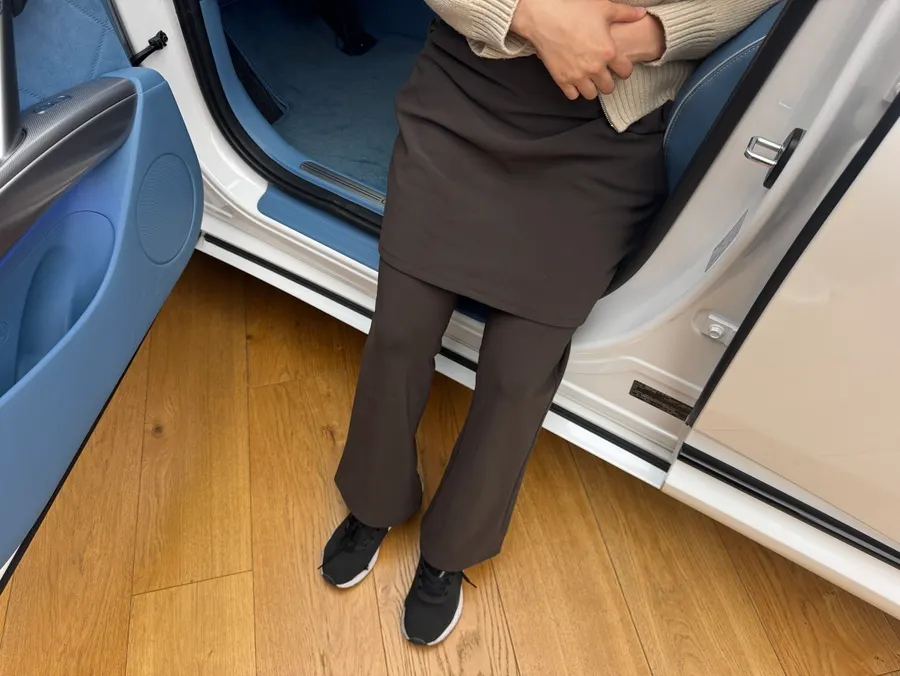 Skirt-overlay pants paired with a hoodie