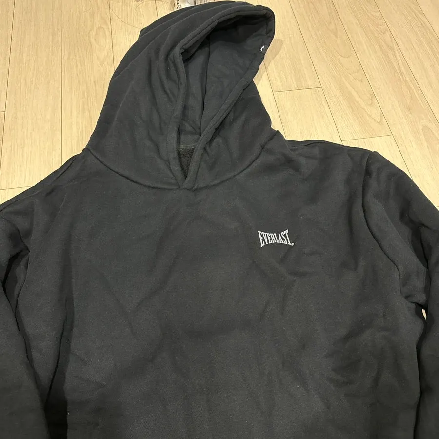 Hooded zip-up and jogger pants worn together