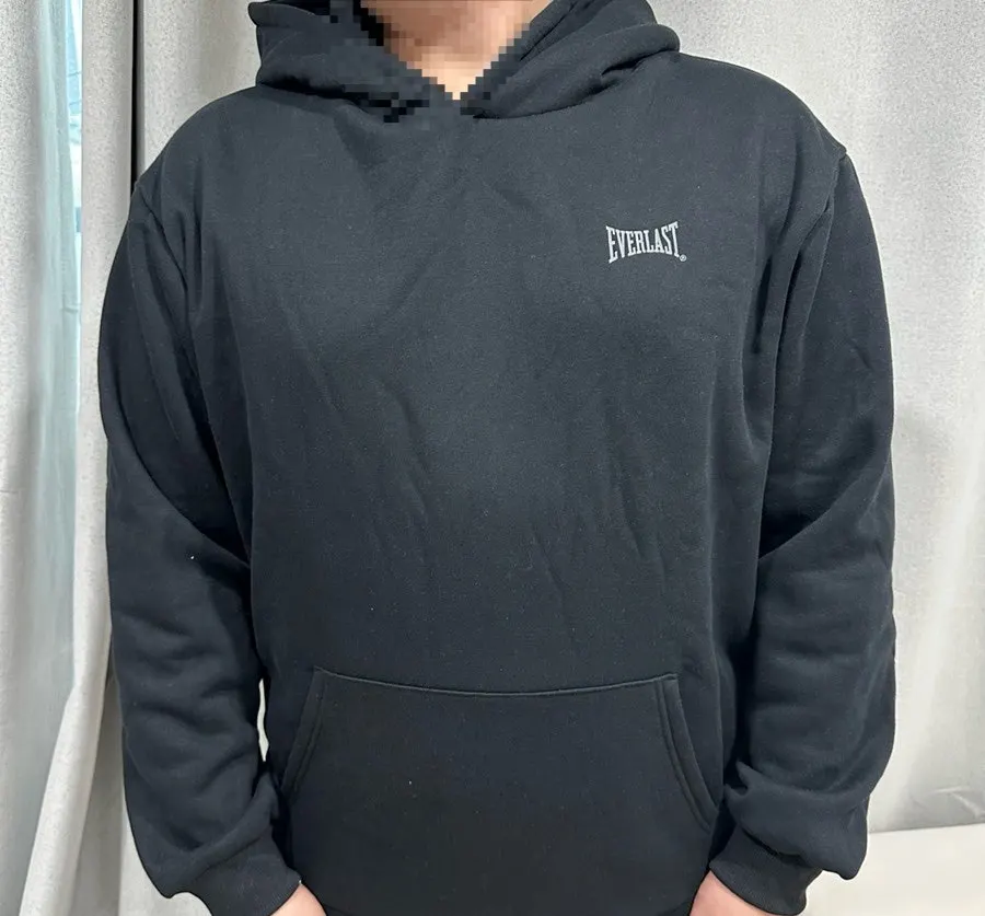 Black fleece tracksuit worn casually
