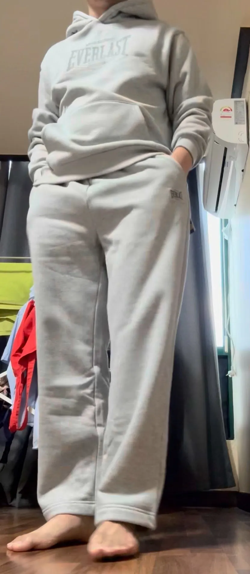 Wearing the fleece-lined tracksuit while seated