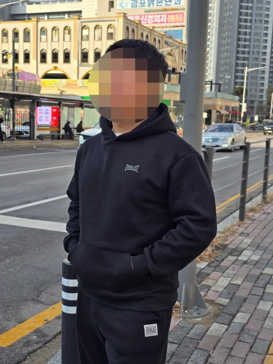 Man wearing a fleece-lined tracksuit