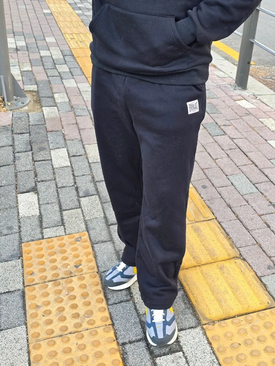 Full-body view of a man wearing straight-leg pants