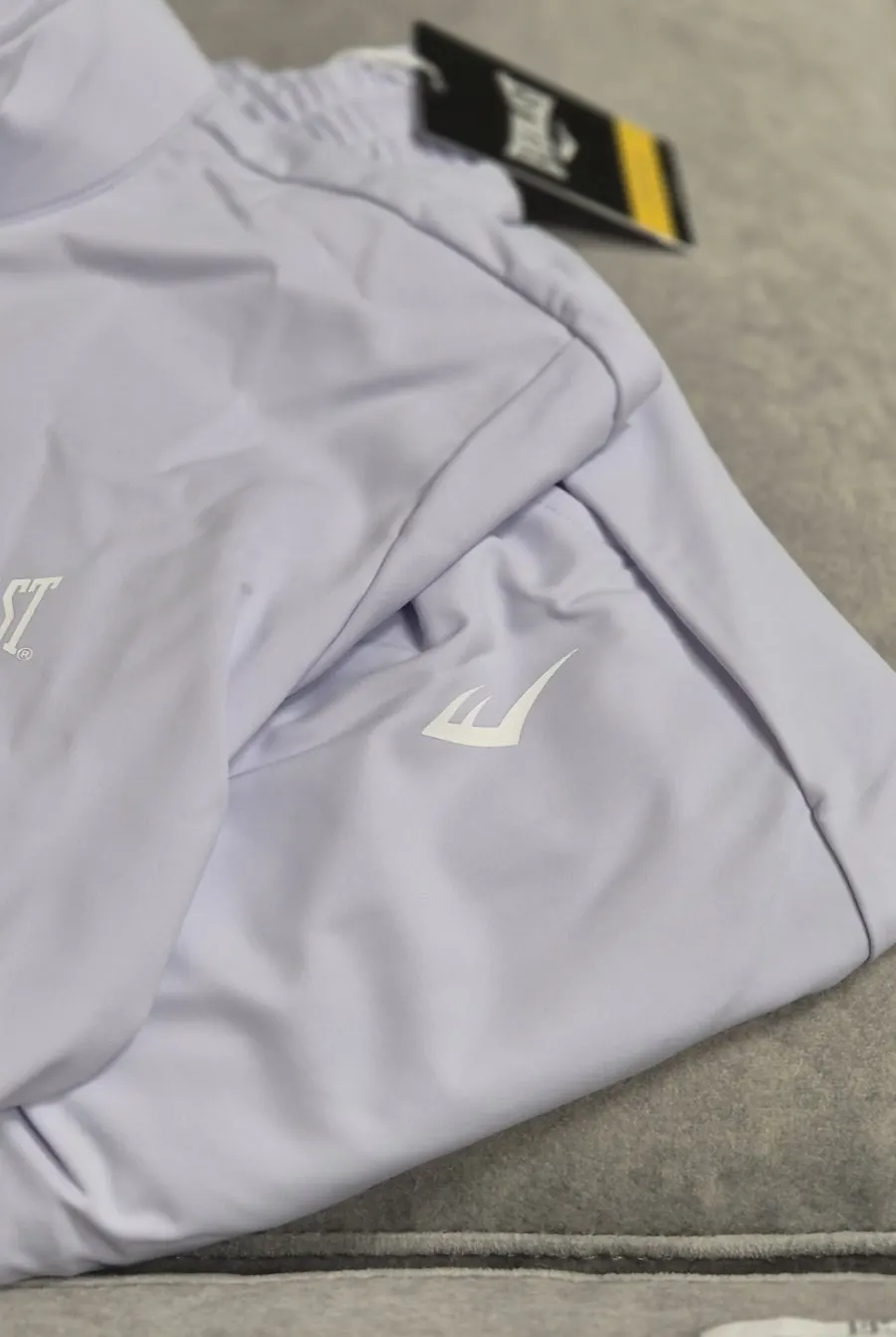 Wearing the lavender running jacket and bootcut pants