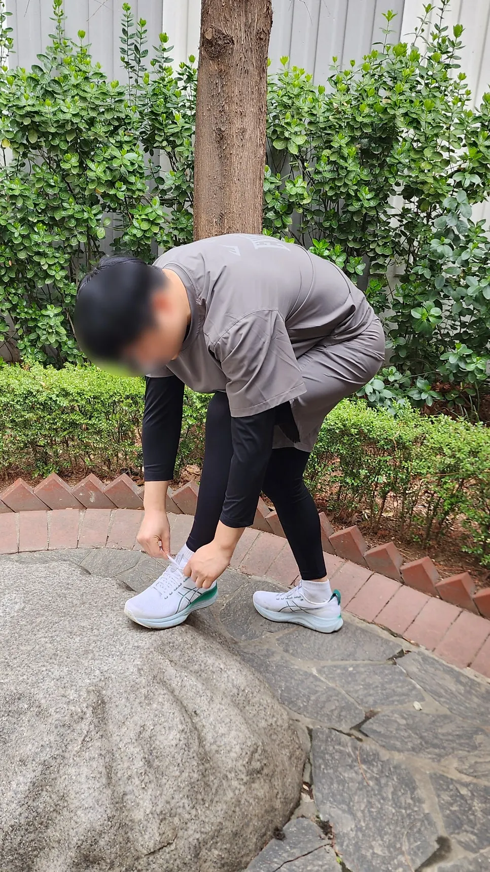 Wearing khaki gray Everlast running wear
