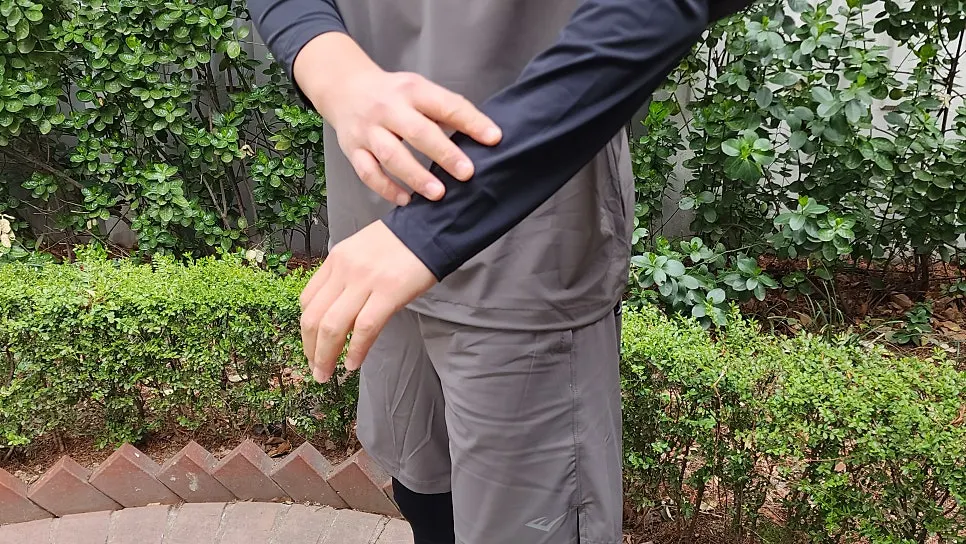 Bending down to tie running shoe laces while wearing running wear