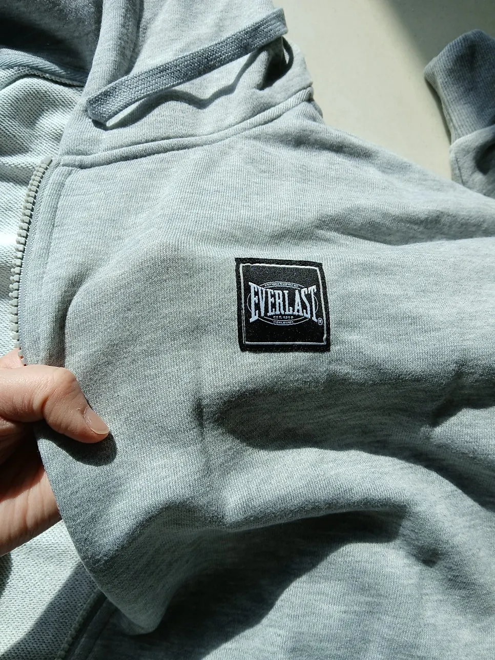 Everlast hood zip-up and straight pants worn together