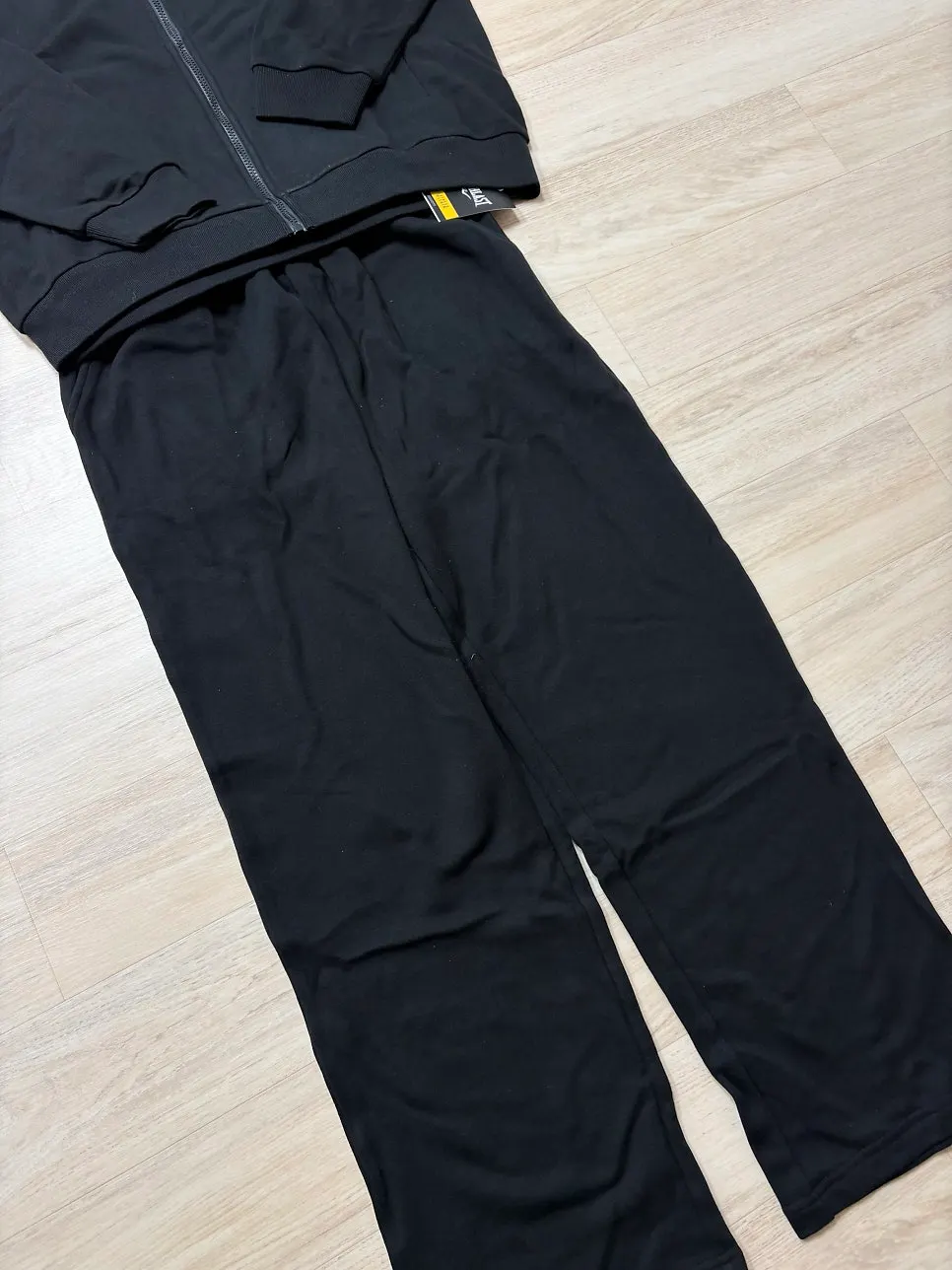 Fabric details of the mini terry hood zip-up and straight-leg pants