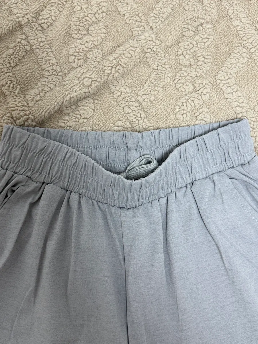 Gray jogger pants with elastic at the waist and hems