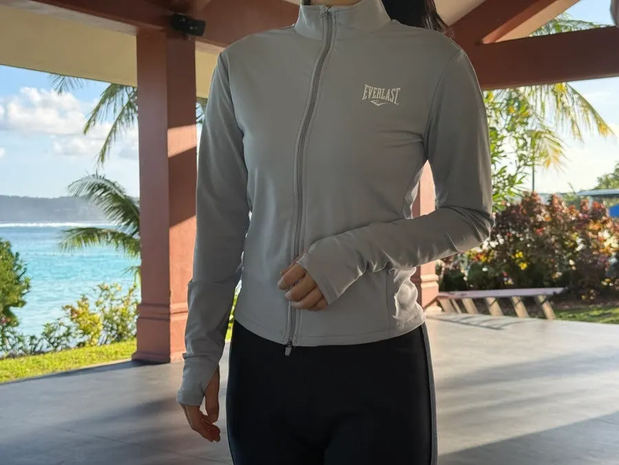Ash blue running jacket paired with black bootcut pants
