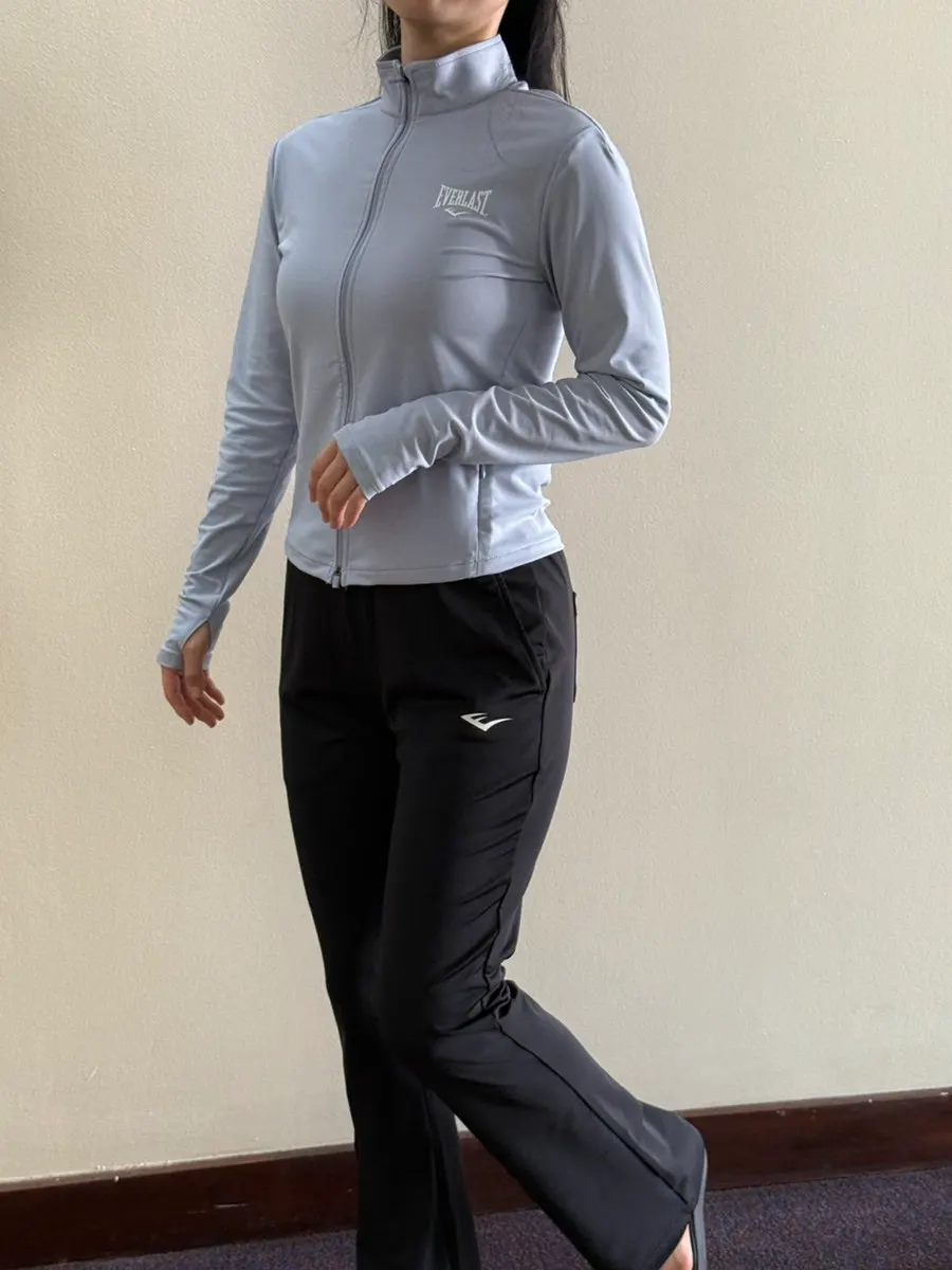 Running jacket finger holes that hold sleeves in place during yoga