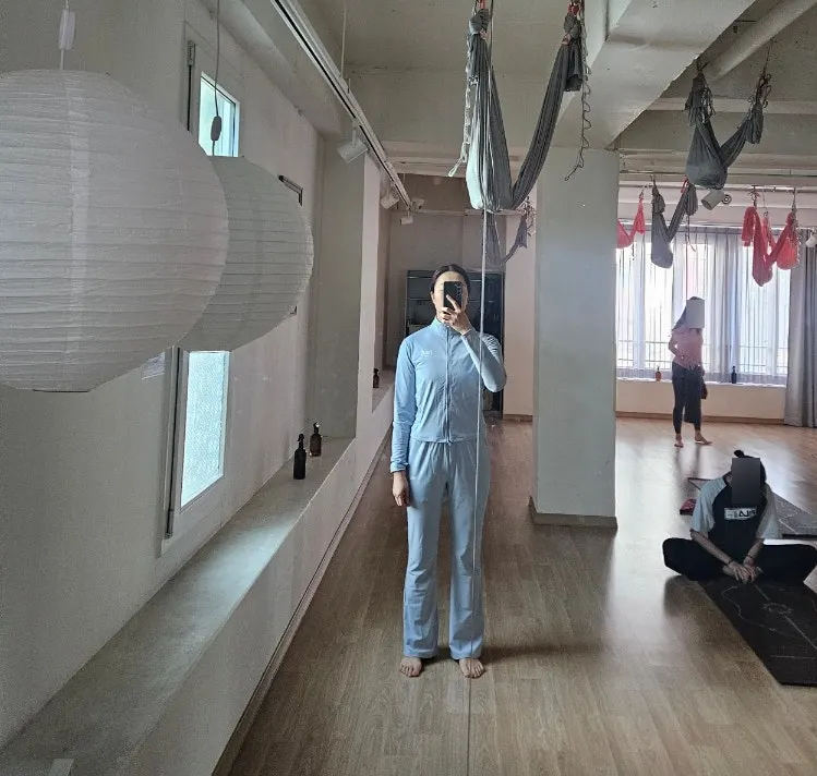 Ash blue running outfit worn for indoor yoga