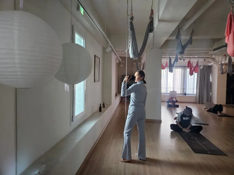 Running outfit stretch tested during yoga
