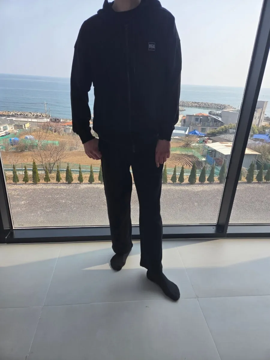 Hoodie zip-up and straight-leg pants styled for a light outing