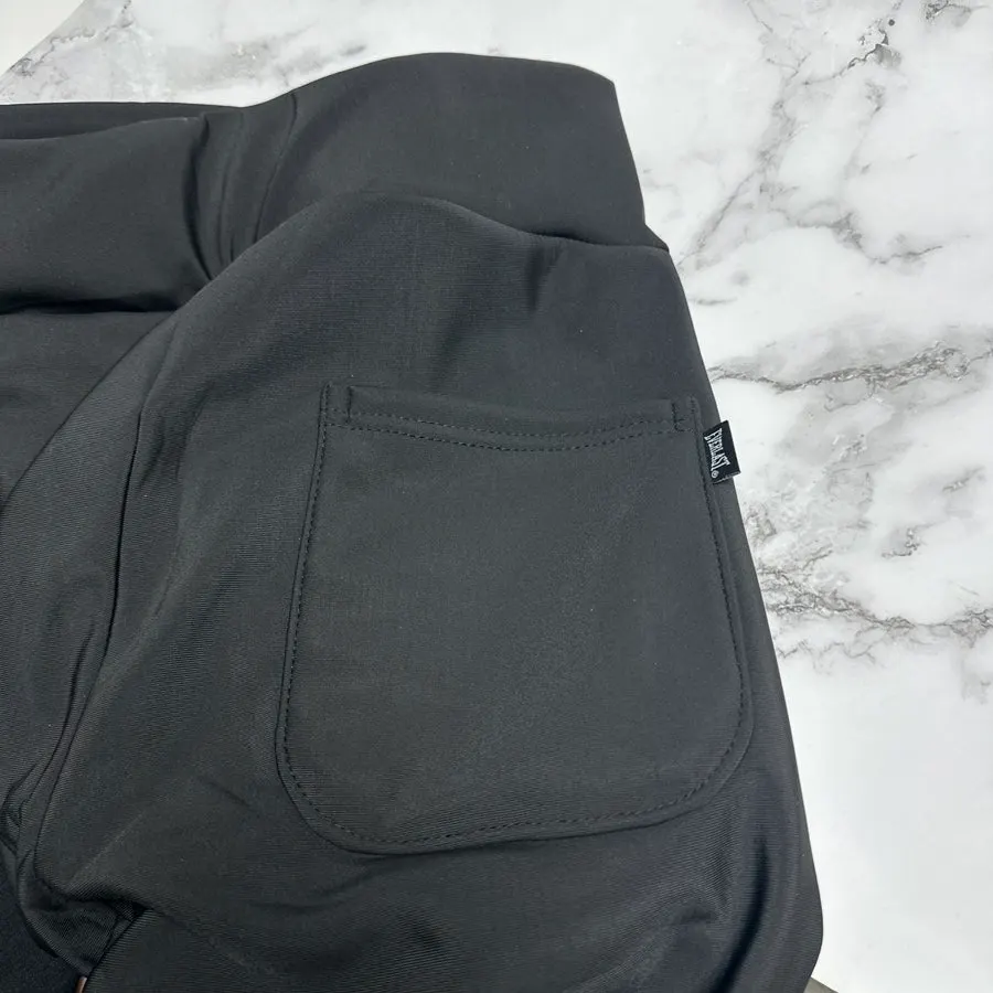 Fleece-lined slacks with a visible bootcut hem