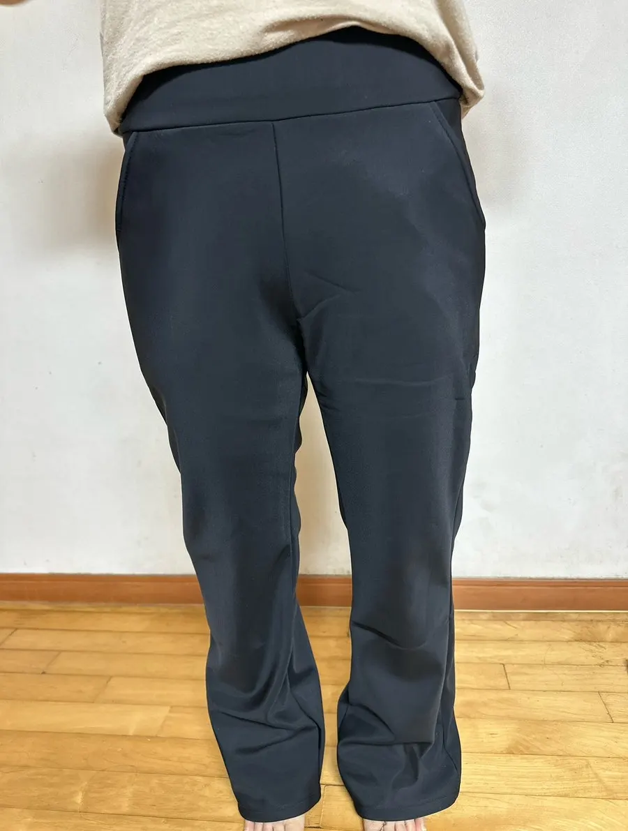 Full-body view of bootcut slacks being worn