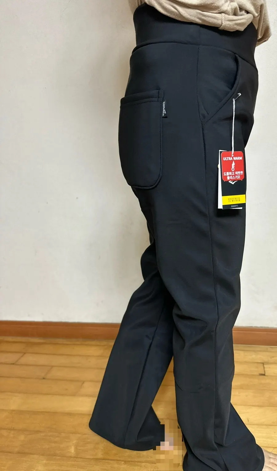 Elastic-waistband slacks being worn