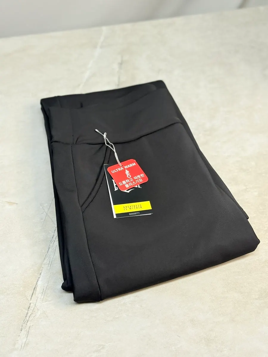 Full-body view wearing black bootcut fleece pants