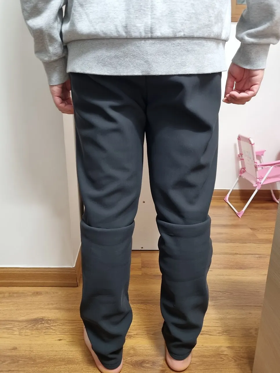Full-length view of fleece-lined training pants worn