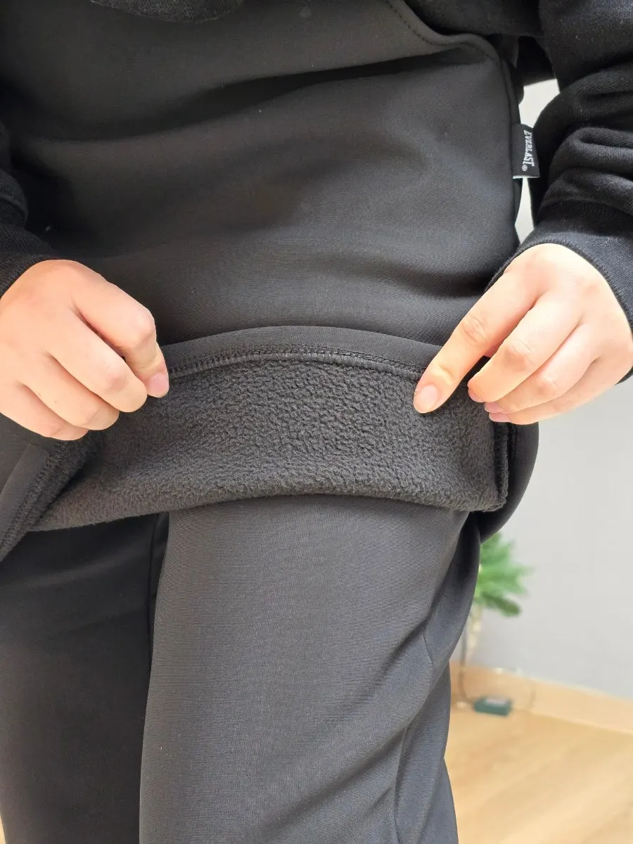 Black fleece-lined skort pants in a winter outfit