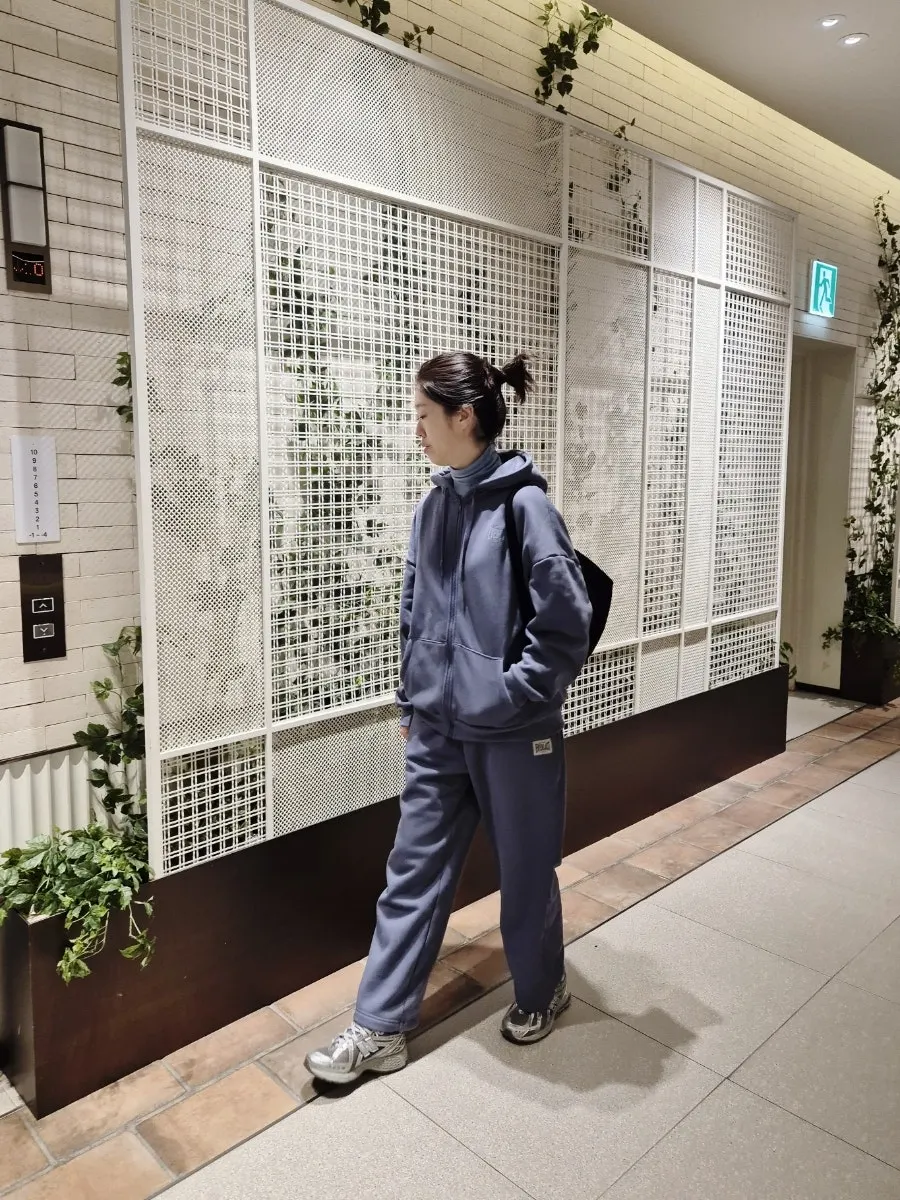 Wearing the Ash Blue fleece-lined tracksuit set