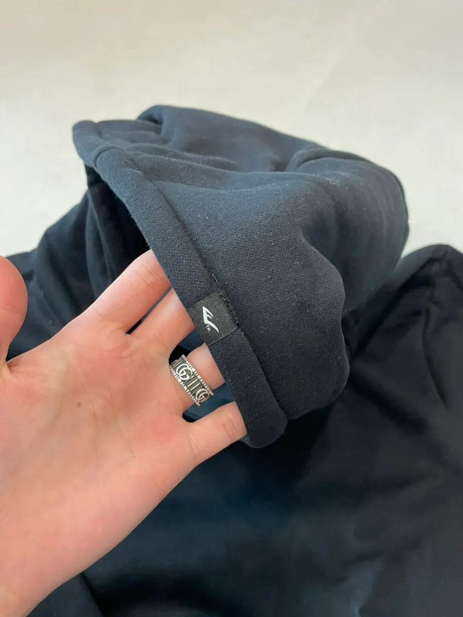 The hoodie’s logo detail and pocket