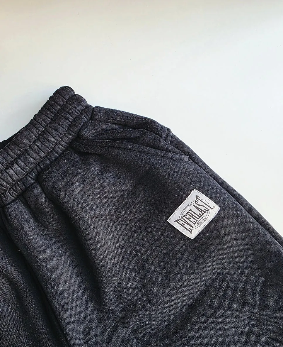 Tracksuit worn with straight-leg pants