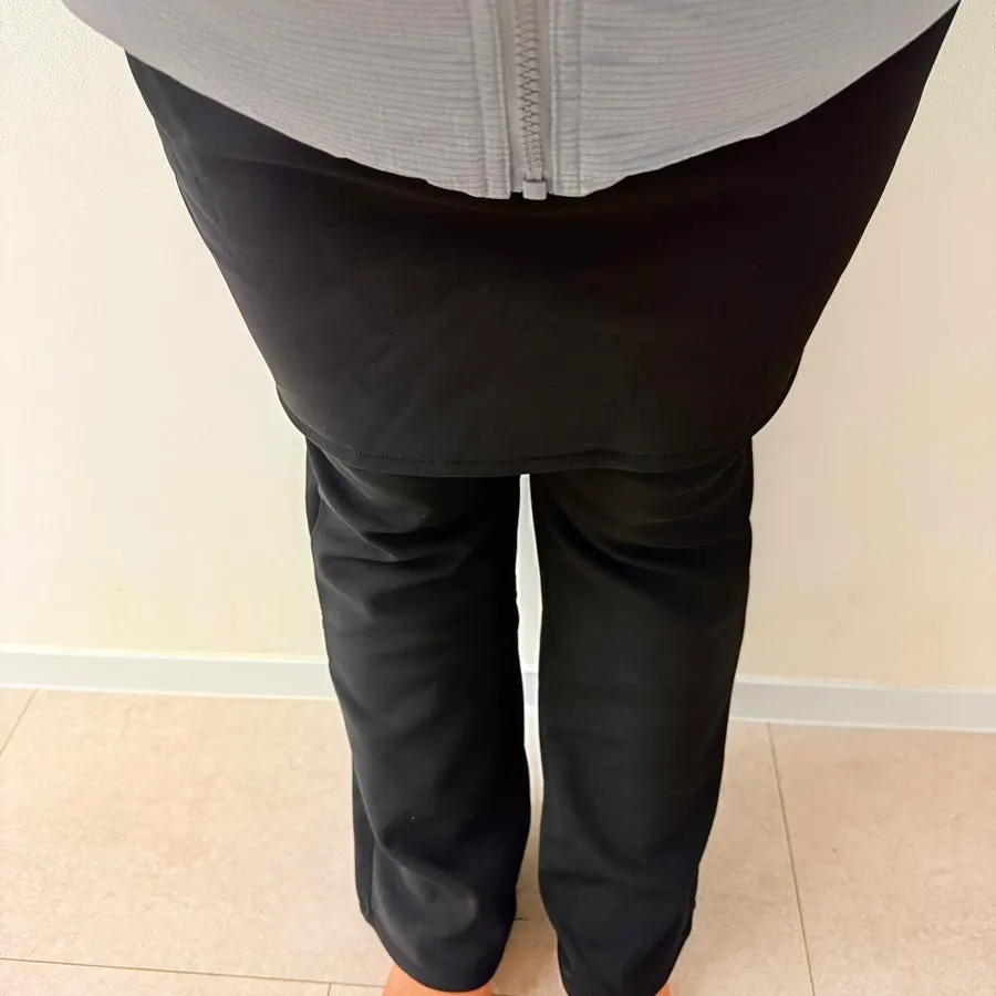 Black skirt pants worn as a work outfit