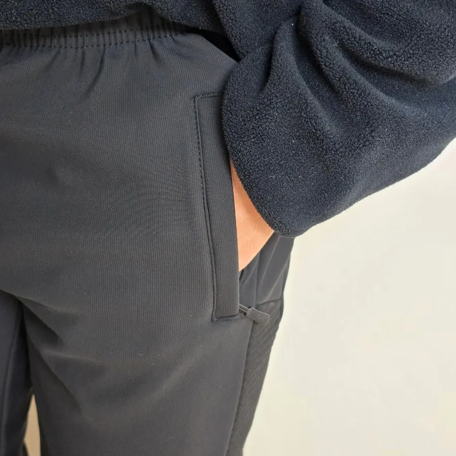 Pants detail with zippered pockets on both sides