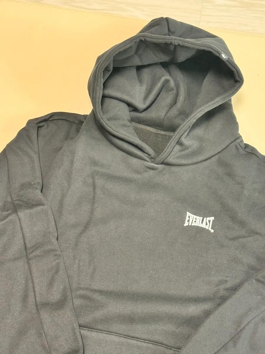 Wearing the black fleece-lined hoodie and straight-leg pants set