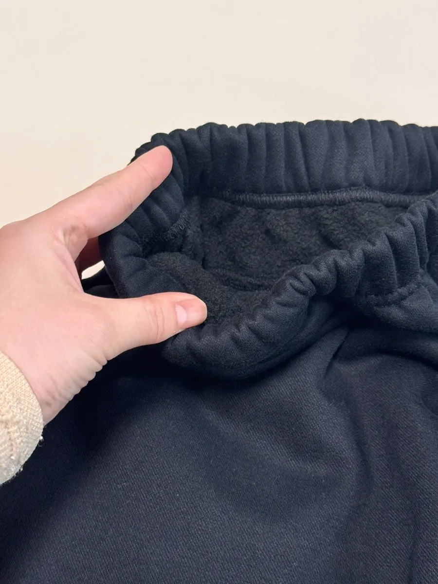 Wearing the straight-fit fleece-lined training pants