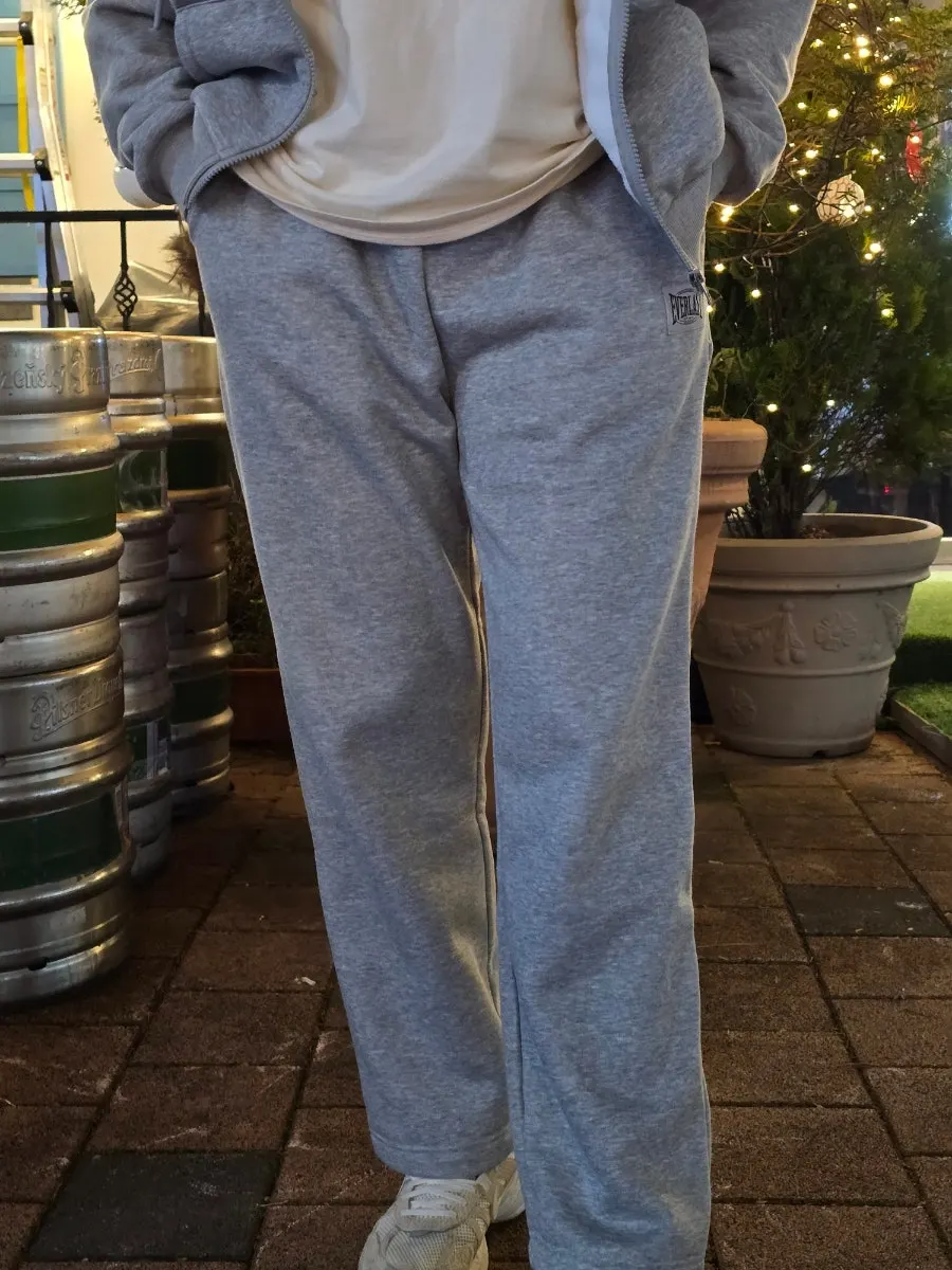 Fleece tracksuit top-and-bottom set worn
