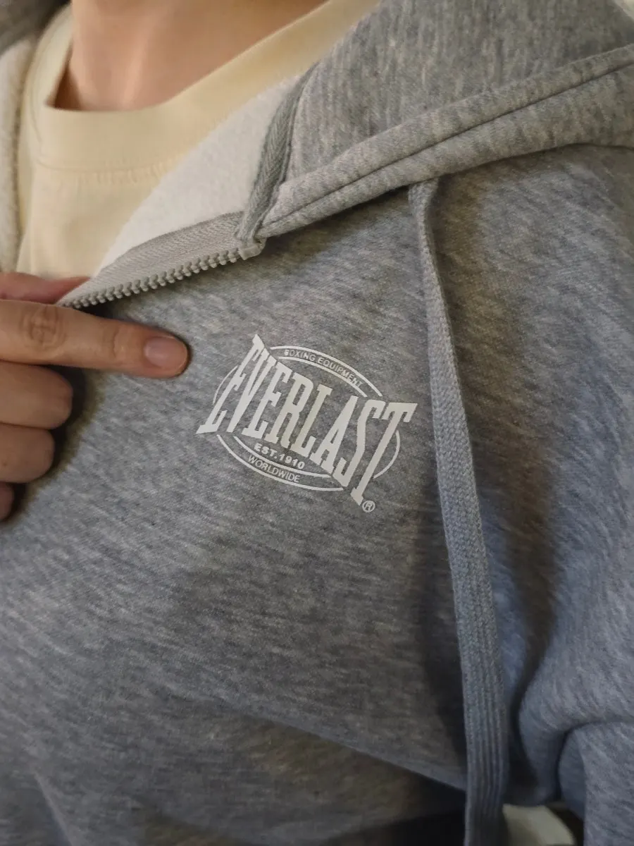 Full-body view of the melange gray fleece set