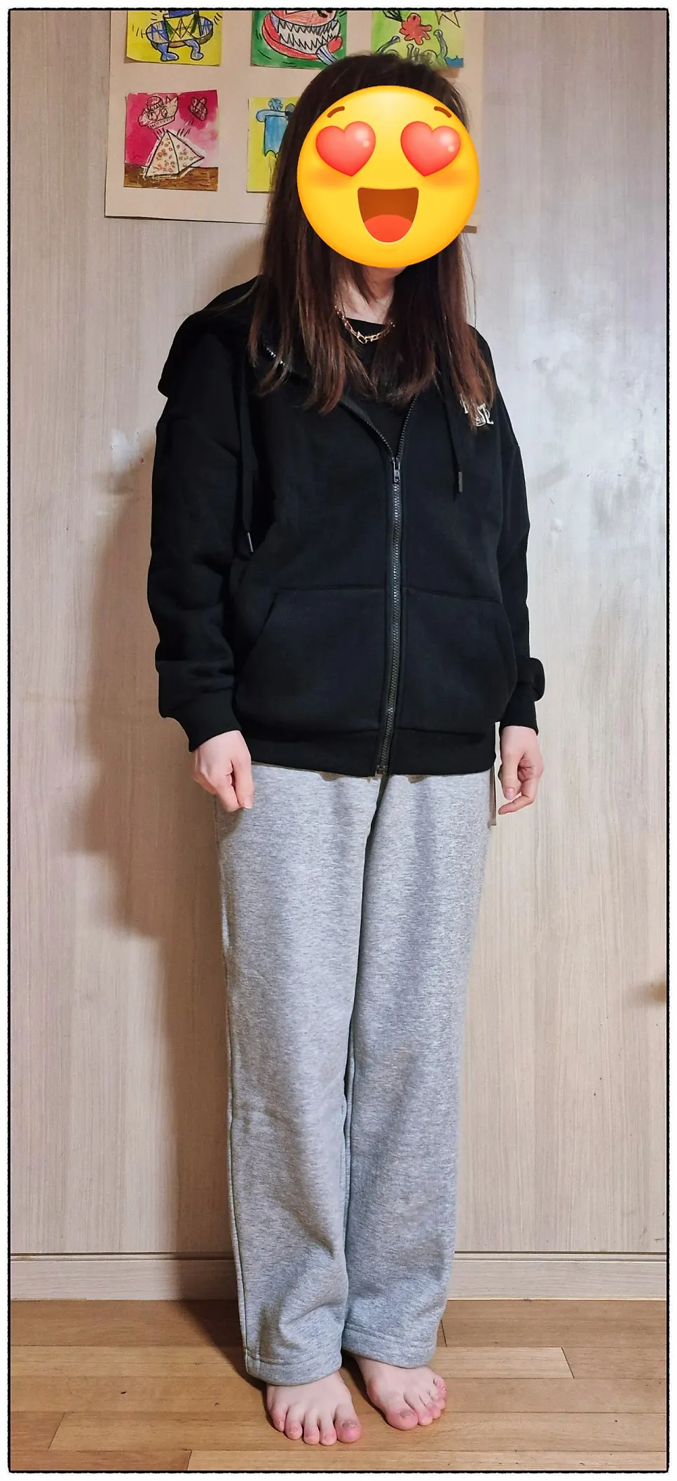 Black top and melange gray pants worn together