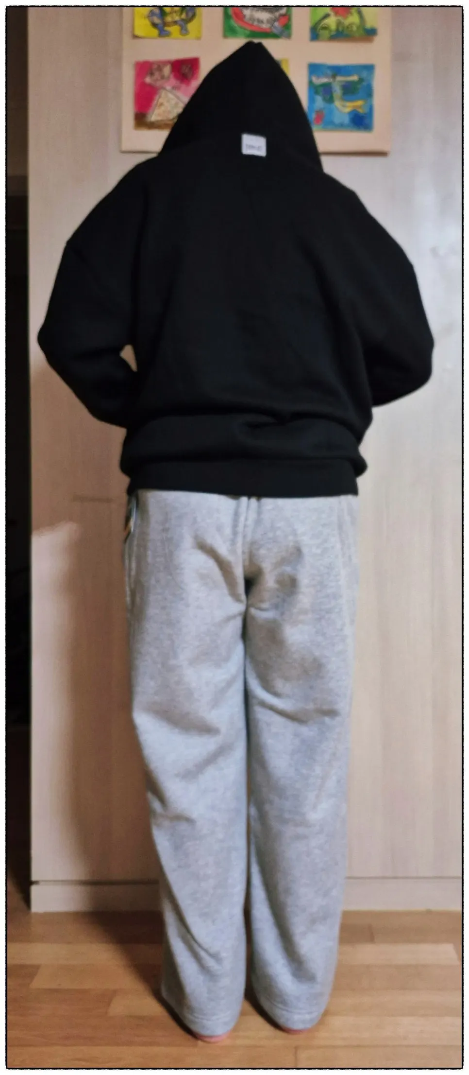 Full-body view of the hood zip-up and straight-leg pants