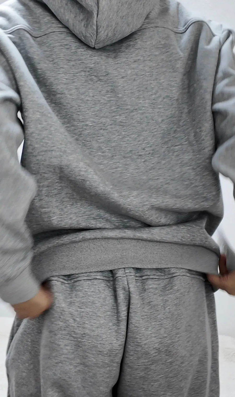 Tracksuit paired with winter outerwear