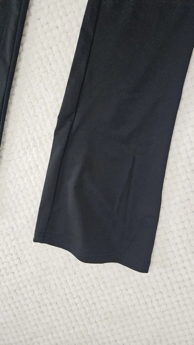 Running jacket and bootcut pants worn together