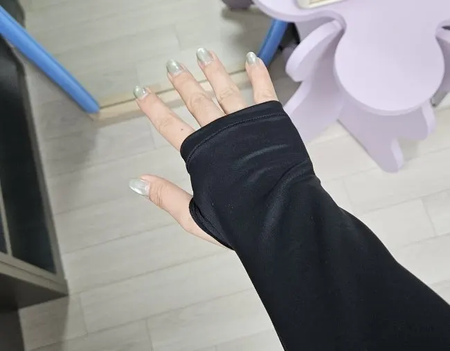 Sleeve and hand area of the black running jacket