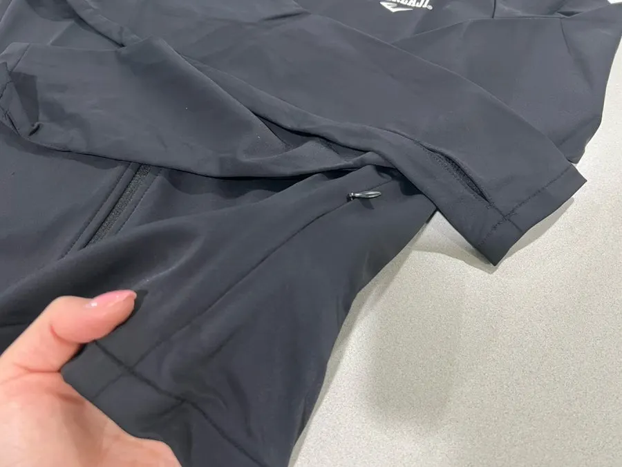 Zippered pocket detail on the Everlast running jacket