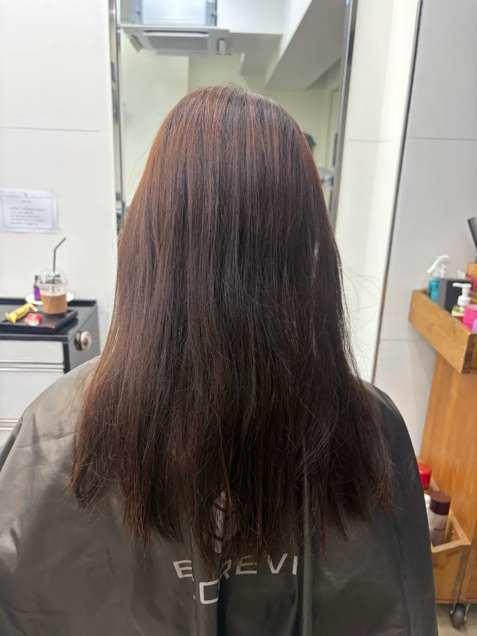 Hair before coloring showing color difference near the part line