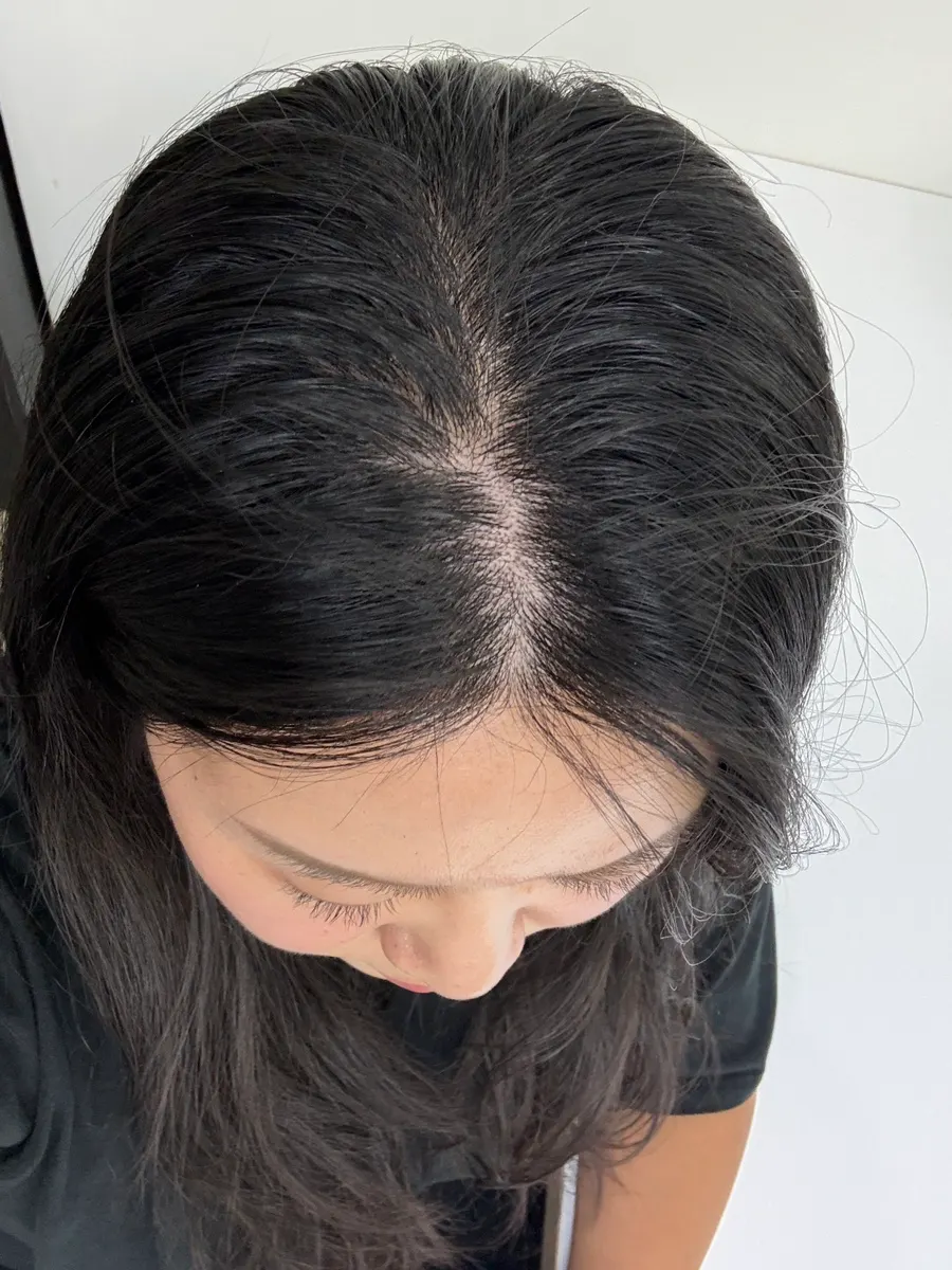 Long hair damaged by a hippie perm before the treatment