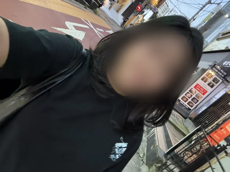Selfie showing the lighter length of the layered cut