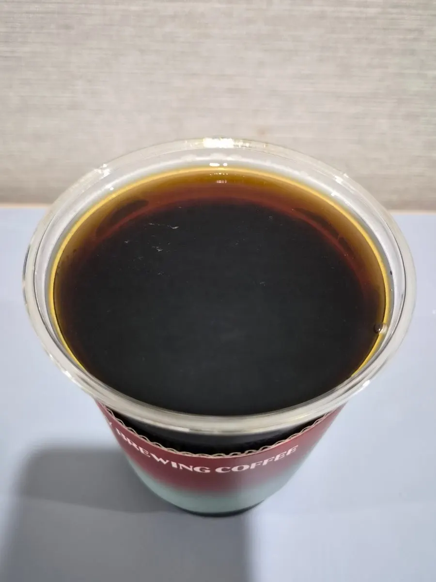 Sign of brewed coffee options with a cup of coffee