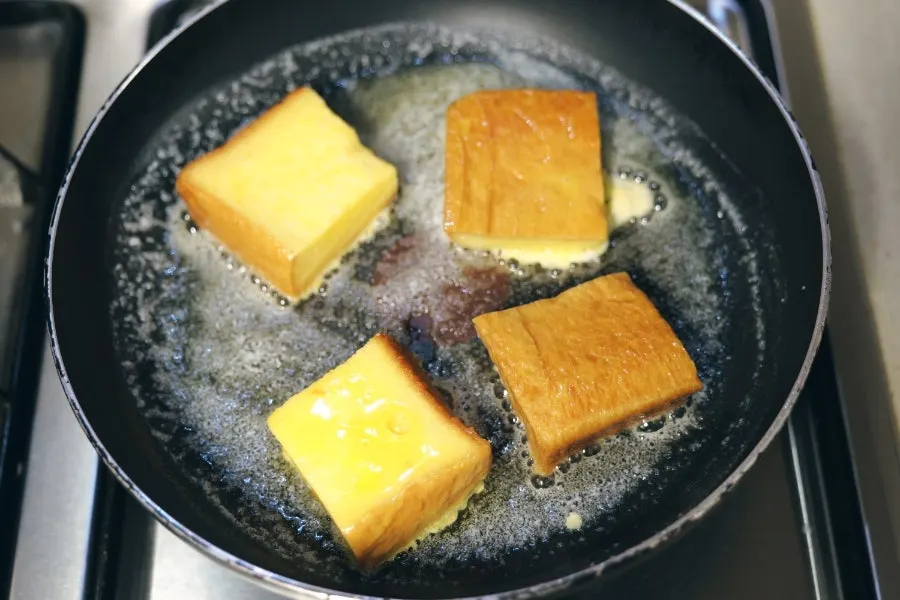 Bread frying in a pan with melted butter